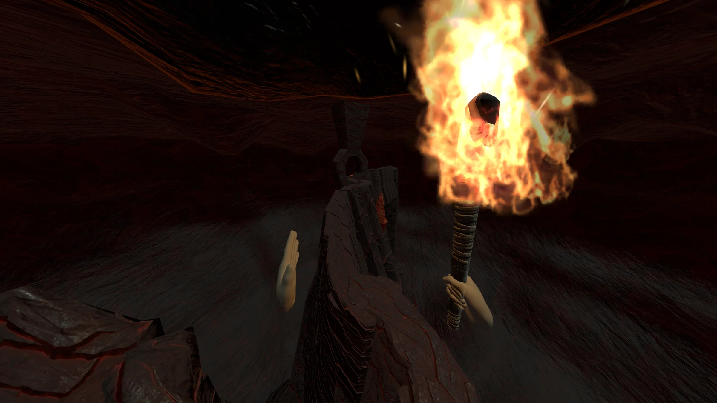 A flaming torch illuminates the narrow stone bridge through the cavern